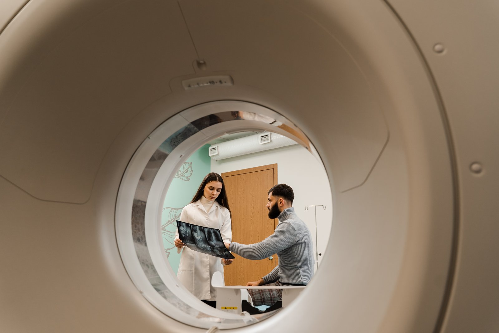 Radiologist discussing CT scan results with a patient